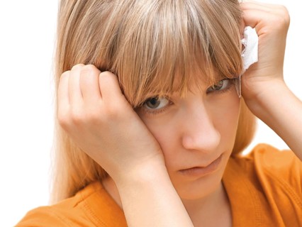 Young woman holding a tissue