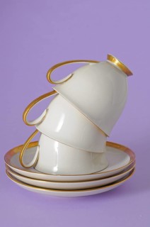 Antique coffee cups with a gold rim