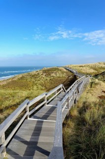 The boardwalk leads through the dunes to the beach of Wenningstedt