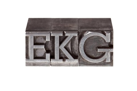 Old lead letters form the acronym 'EKG'