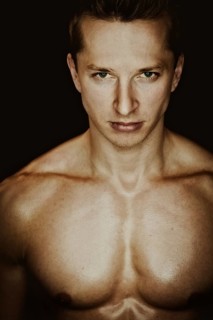 Young man with a muscular upper body