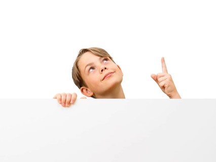Schoolboy behind a white board