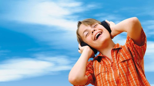 Boy listening to music with headphones