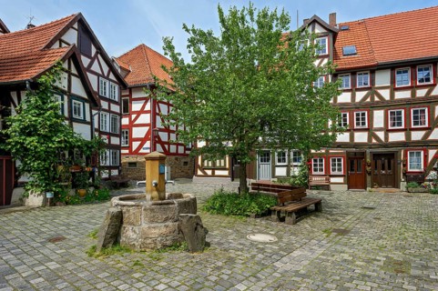 Half-timbered houses and fountain on a small square