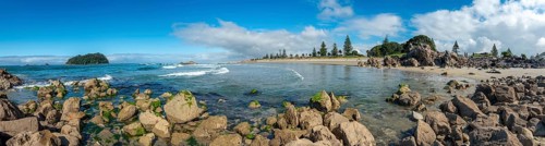 Sandy beach beach of Mount Manganui with island Motiti Island