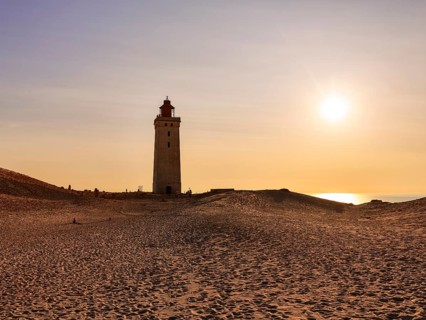 Lighthouse on the moving dune Rubjerg Knude at sunset