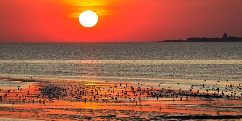 Orange-red sunset over the North Sea