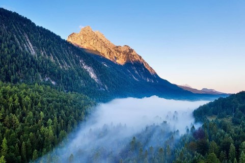 Wettersteinspitze and fog above Ferchenseehohe at sunrise