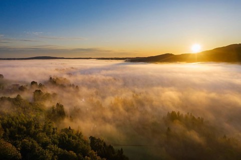 Sunrise with ground fog over Attenloher Filzen near Gaissach