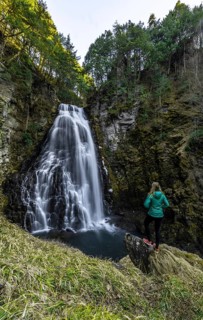 Woman standing in front of Bandokoro Waterfall