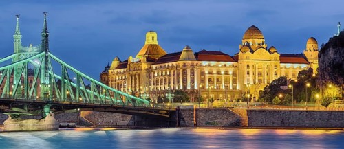 Gellertbad with Freedom Bridge illuminated