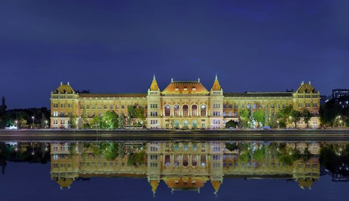 University with reflection in the Danube
