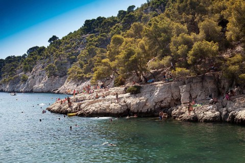 Beach vacationers at the beach in the bay Calanque de Port-Pin