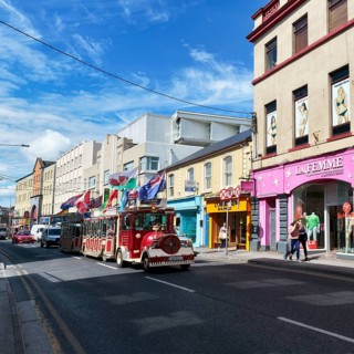 Tourist train runs through downtown Galway