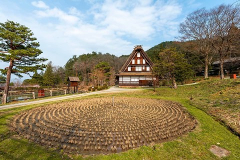 Round rice field with farmhouse