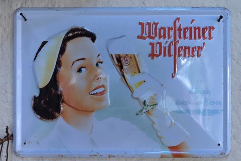 Nostalgic tin advertising sign