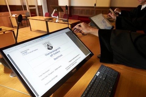 Judges train in the courtroom of the Higher Regional Court in Koblenz the electronic court file
