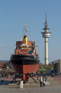 Tugboat Stier at the Museumshafen and Radio Tower