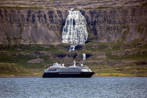 Cruise ship anchored in a fjord