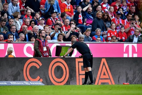 Referee Referee Marco Fritz watch video evidence on monitor