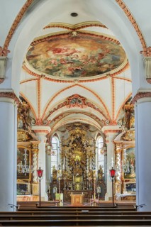 Church nave with main altar and ceiling fresco
