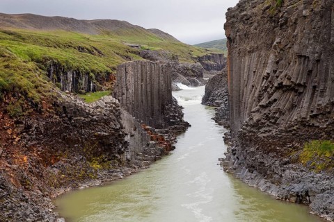 Studlagil gorge with basalt columns and glacial river Jokulsa a Bru