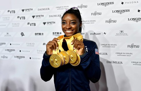 Simone Biles USA presents her 5 gold medals of the World Championships in Gymnastics
