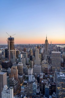 View of Midtown and Downtown Manhattan and Empire State Building from Top of the Rock Observation Center at sunset