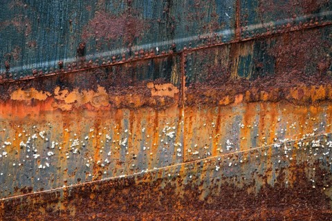 Rusty hull with barnacles