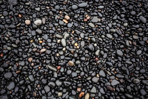 Black lava pebbles at Reynisfjara Beach