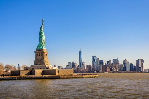 Statue of Liberty in front of Manhattan skyline