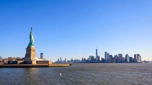 Statue of Liberty in front of Manhattan skyline