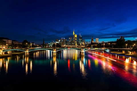 Illuminated Skyline and Ignatz Bubis Bridge at Blue Hour