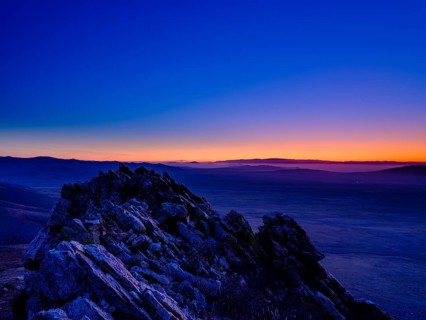 View from a summit to Mongolian steppe at blue hour