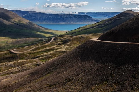 Gravel road meanders through volcanic landscape