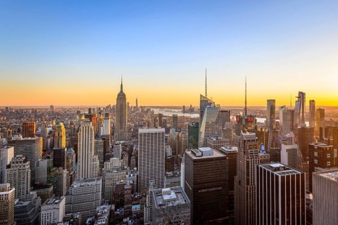 View of Midtown and Downtown Manhattan and Empire State Building from Top of the Rock Observation Center at sunset