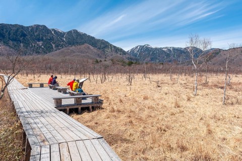 Hikers rest along the hiking trail through the Senjogahara Marsh