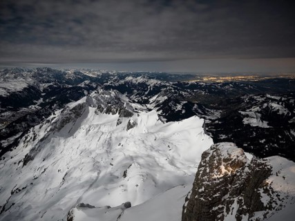 View from Santis to snow-covered mountain landscape at full moon