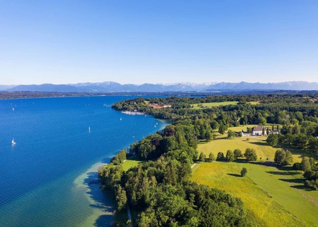 Castle Hohenried and Bernried at Starnberger See with Alpine chain