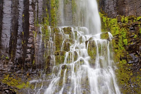 Waterfall over mossy rocks