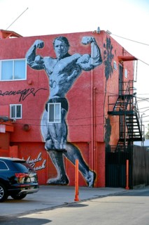 Wall painting by Arnold Schwarzenegger on a building at the speedway of Venice Beach
