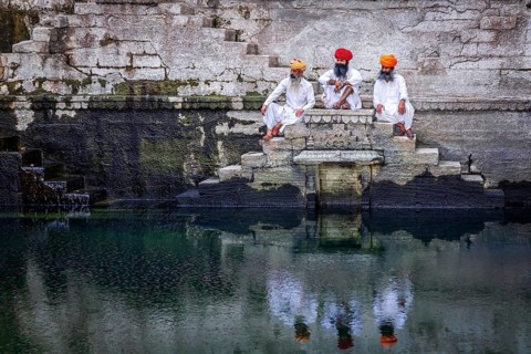 Three men resting at the stepwell Toorji Ka Jhalra in Jodhpur
