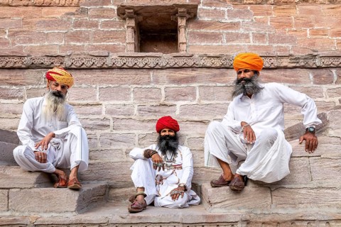 Three men resting at the stepwell Toorji Ka Jhalra in Jodhpur