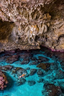 Tourist snorkeling in the Avaiki rock tide pools