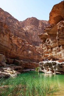 Freshwater pool between rugged cliffs