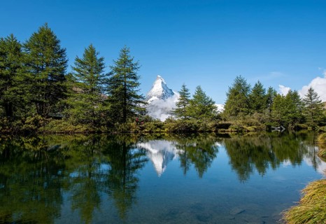 Snow-covered Matterhorn reflected in the lake