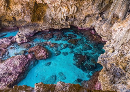 Tourists snorkeling in the Avaiki rock tide pools