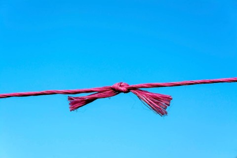 Knot in the middle of red string