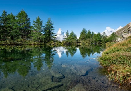 Snow-covered Matterhorn reflected in the lake