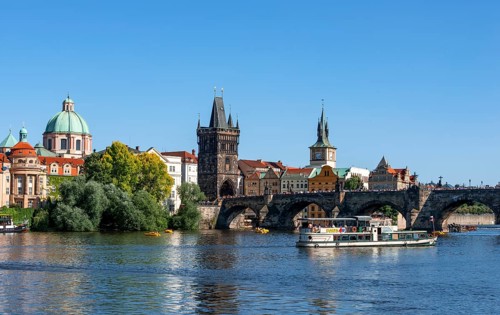 View over the Vltava River to Charles Bridge and Old Town with Kreuzherren Church and Old Town Bridge Tower